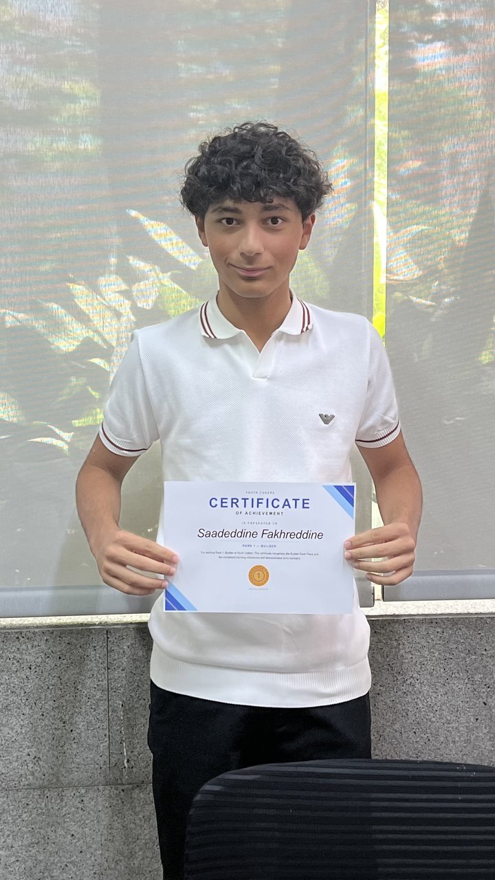Student with their certificate
